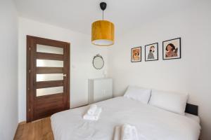 Posteľ alebo postele v izbe v ubytovaní MarOks Żółwia Apartment