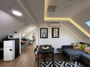a living room with a couch and a table at MAIN SQUARE Apartment in Belgrade