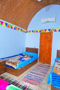 Katil atau katil-katil dalam bilik di Sehel Nubian House