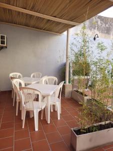 a white table and chairs on a patio at HOSTAL con terraza y parrilla en Palermo in Buenos Aires