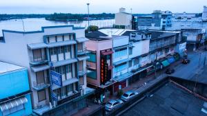 an overhead view of a city with buildings and a street at 2street Hostel in Suratthani