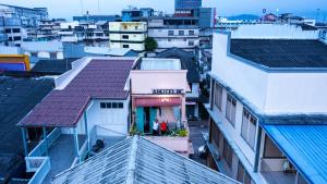 an overhead view of roofs of buildings at 2street Hostel in Suratthani