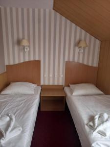 Cama o camas de una habitación en Hotel Atlantis