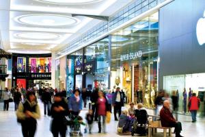 a crowd of people walking through a shopping mall at South Shield's Hidden Gem Amethyst 3 Bedroom House in South Shields