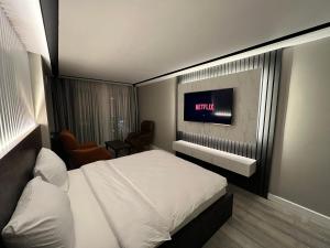 Postel nebo postele na pokoji v ubytování BALA HOTEL