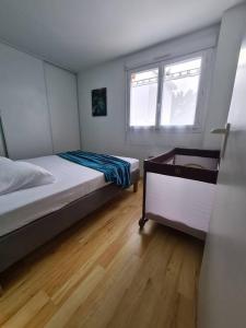 Posteľ alebo postele v izbe v ubytovaní Chez Aurore & Jérémy en Vendée - Jolie maison cosy tout près des plages de l'Atlantique