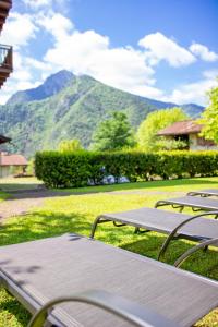 a picnic table with a view of a mountain at Casa Elena in Ledro
