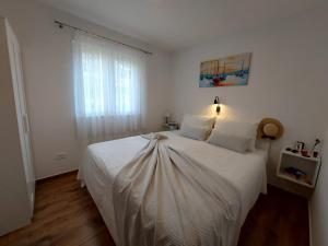Postel nebo postele na pokoji v ubytování Apartments Gracia & Toni