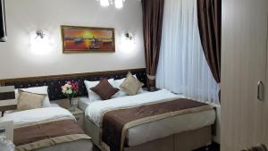 Postel nebo postele na pokoji v ubytování BeyazitHan Suites Old City
