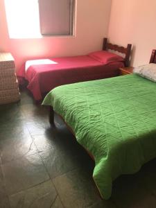 Ένα ή περισσότερα κρεβάτια σε δωμάτιο στο Apto quarto e sala, pé na Lagoa de Iguaba