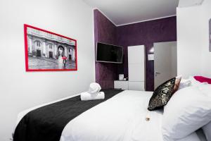 Postel nebo postele na pokoji v ubytování Relais Circo Massimo