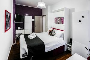 Postel nebo postele na pokoji v ubytování Relais Circo Massimo