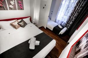 Postel nebo postele na pokoji v ubytování Relais Circo Massimo