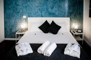 Postel nebo postele na pokoji v ubytování Relais Circo Massimo