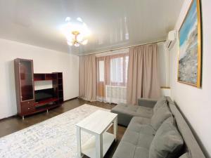 A seating area at Комфортные двухкомнатные апартаменты в центре города Самал 2
