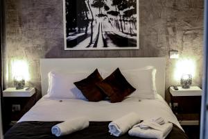 Postel nebo postele na pokoji v ubytování Relais Circo Massimo