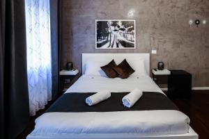 Postel nebo postele na pokoji v ubytování Relais Circo Massimo