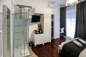 Postel nebo postele na pokoji v ubytování Relais Circo Massimo