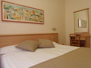 Posteľ alebo postele v izbe v ubytovaní Hotel Astor