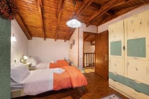 Postel nebo postele na pokoji v ubytování Chalet Renata 2 Livadi Arachovas
