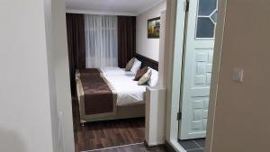 Postel nebo postele na pokoji v ubytování BeyazitHan Suites Old City
