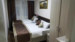 Postel nebo postele na pokoji v ubytování BeyazitHan Suites Old City