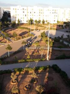 an overhead view of a park with benches and buildings at Appartement Adrar in Agadir