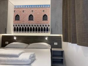 Posteľ alebo postele v izbe v ubytovaní Camping Venezia Village