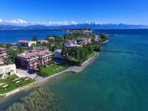 an aerial view of a resort on the water at Smeraldo dip Villa Canneto in Sirmione