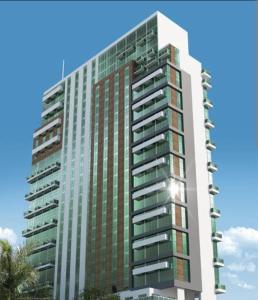 a tall building with glass windows on the side of it at Flat luxo, mobiliado c/ ar, wi-fi, pisc. e academia in Barueri