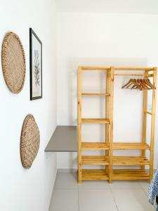 a room with a wooden ladder and a shelf at Casa Iva - Condomínio Fechado in Marechal Deodoro