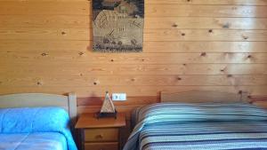 A bed or beds in a room at Casa Rural los Caños