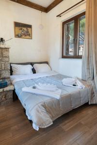 מיטה או מיטות בחדר ב-Arachova "Villa Dianne"
