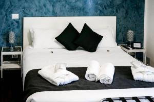 Postel nebo postele na pokoji v ubytování Relais Circo Massimo