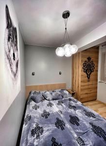 Posteľ alebo postele v izbe v ubytovaní Apartament Wilcza Jama z kominkiem - Viva pod Giewontem Apartamenty
