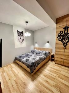 Posteľ alebo postele v izbe v ubytovaní Apartament Wilcza Jama z kominkiem - Viva pod Giewontem Apartamenty