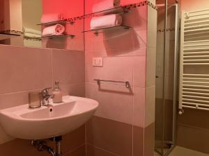 a bathroom with a sink and a shower at Residenza Corte Antica in Venice