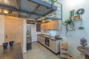 a kitchen with a sink and a counter top at Unique studio loft, walking distance to Valletta in Hamrun