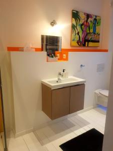 a bathroom with a sink and a toilet at Ferienwohnung am Schloss Colditz in Colditz +32 photos
