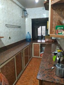 a kitchen with a counter and a counter top at غير متاحه للايجار الرجاء عدم الحجز لانها غير متوفره in Alexandria