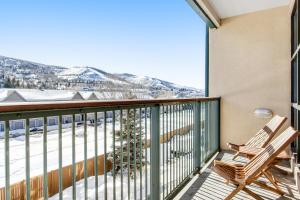 a balcony with a view of a snowy mountain at Chapel Place in Avon