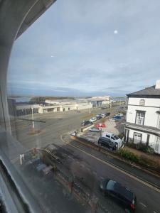 a view from a window of a street with cars at Lakeview Court, Sea and Lake view, free parking in Southport