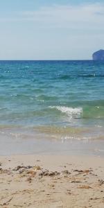 a sandy beach with the ocean in the background at B&B Casa Mia in Alghero