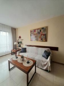 a living room with a bed and a coffee table at nice apartment in hotel ronda 4 first beach line in Fuengirola