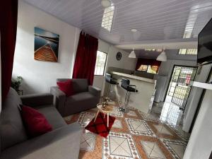 a living room with a couch and a table at Casita de Campo in Sardinal