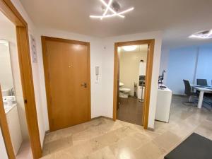 a room with a hallway with a toilet and a door at Corazon de la safor, Ador in Ador +31 photos