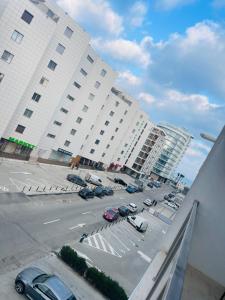 a view of a parking lot in front of buildings at DEEA Residence in Mamaia