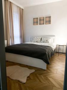 Posteľ alebo postele v izbe v ubytovaní Apartament przy Karmelu