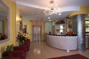 a lobby with a bar in a hospital at Hotel Cristal Eboli in Eboli