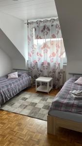מיטה או מיטות בחדר ב-FeWo Oberhausen-Alstaden (Gornig)